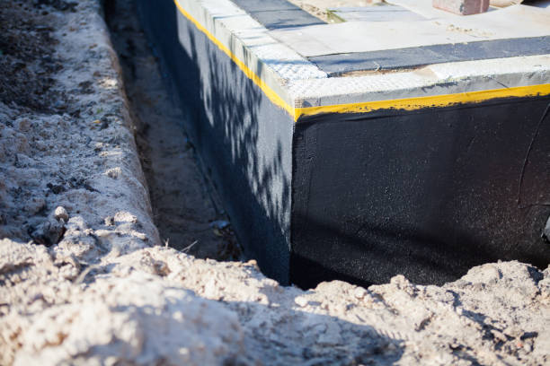 Professional Emergency Waterproofing technician working in Rockford, IL